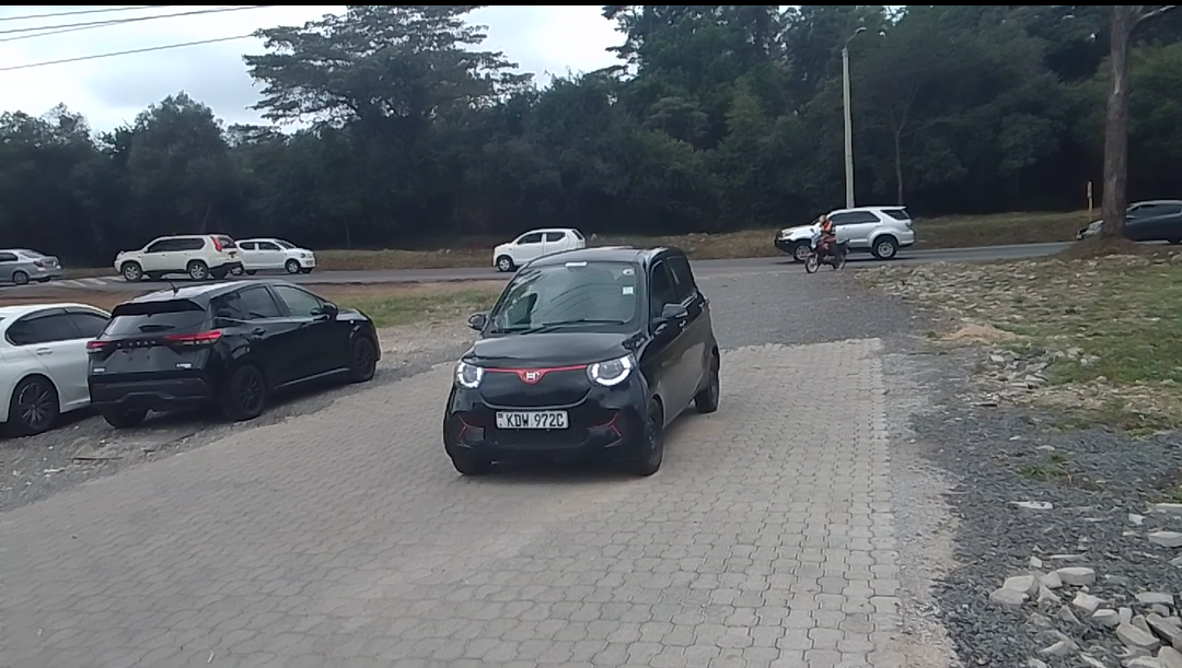 Henry Mini EV leaving the Joe Wa EV charging hub